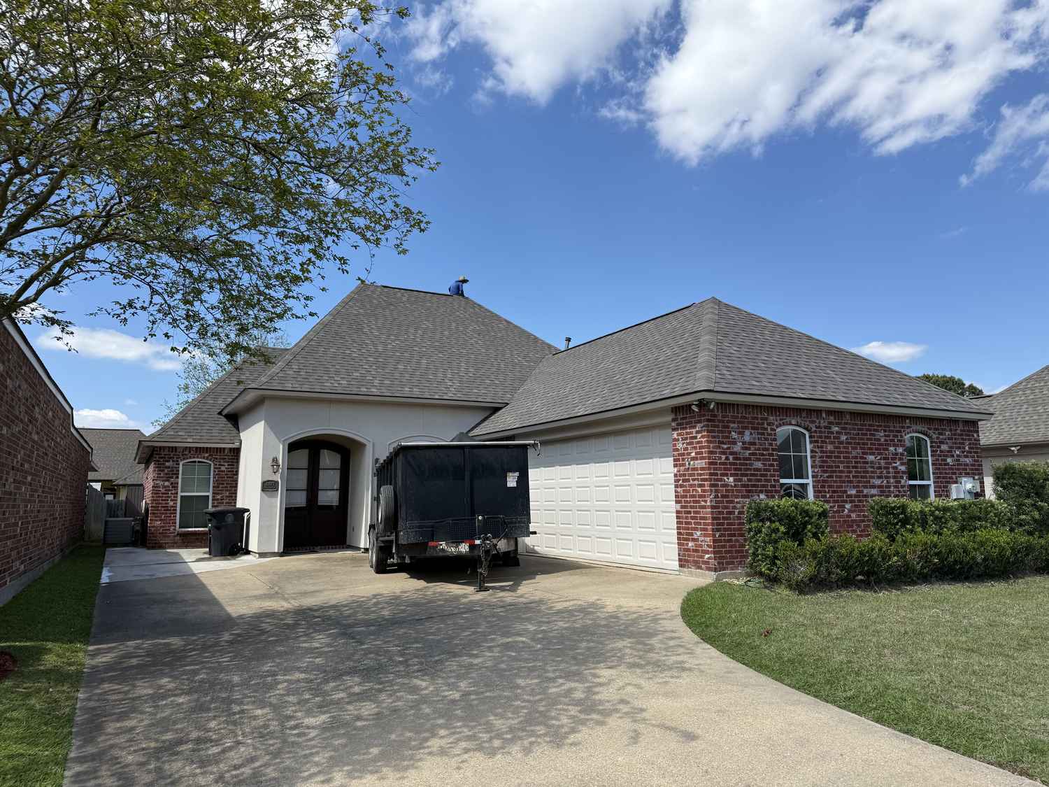 Completed roof replacement on a brick home in Gonzales, Louisiana