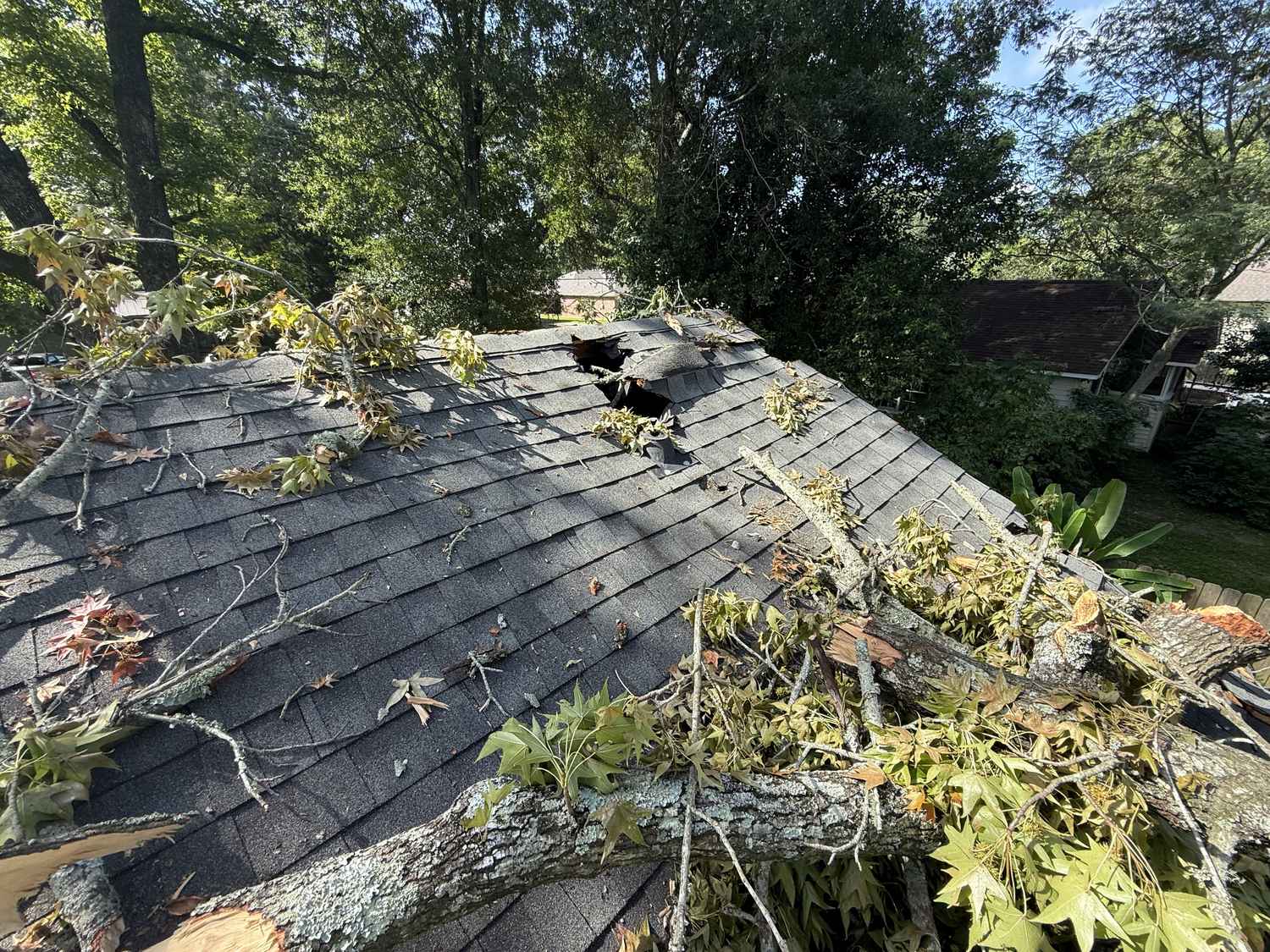 Hurricane storm damage on a Louisiana roof before repair