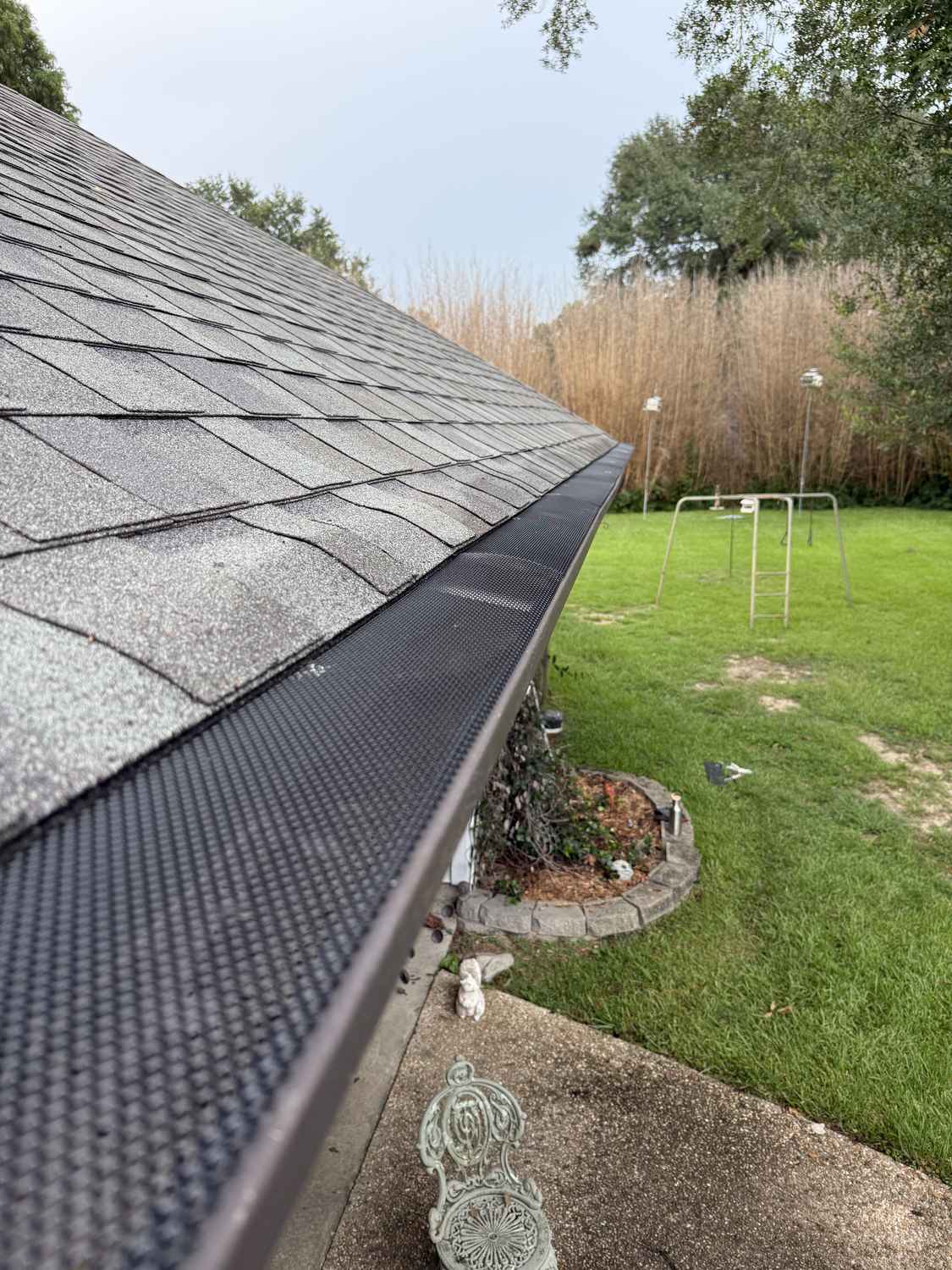 Micro-mesh gutter guard installed on existing gutters