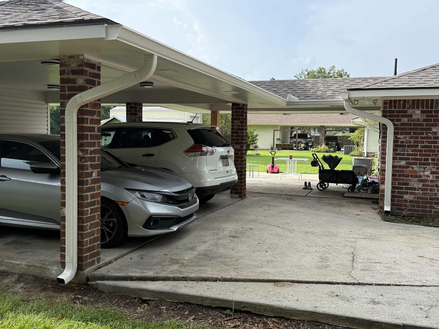 Seamless gutter run installed along a brick home in Ascension Parish, Louisiana